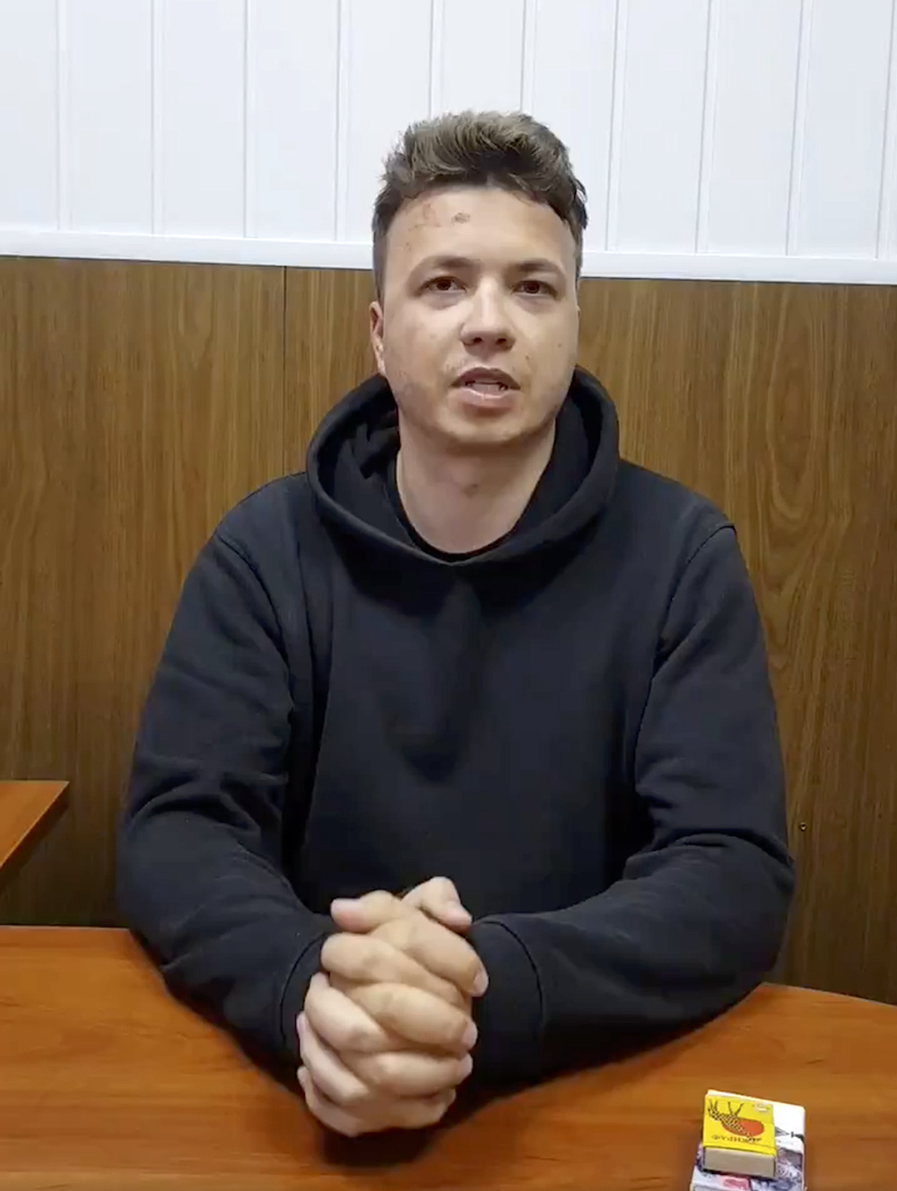 In this photo released Monday, May 24, 2021, by Belarus Government press office, Belarus journalist Raman Pratasevich speaks to a camera in a prison in Minsk, Belarus.
