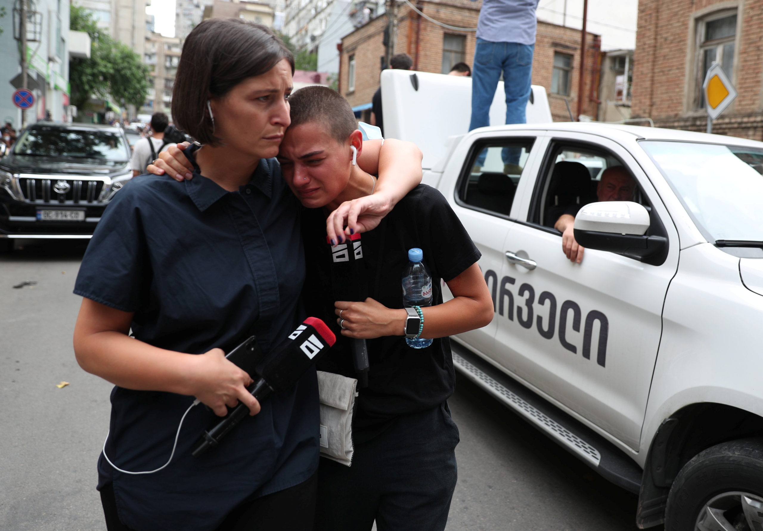 Mourners react during a funeral of journalist Alexander Lashkarava in Tbilisi, Georgia, on July 13, 2021. Lashkarava was found dead at his home several days after he was beaten during attacks on LGBT+ activists in Tbilisi